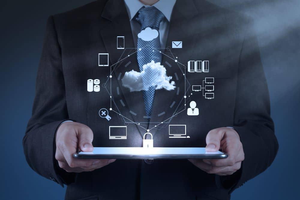 man in suit with tablet and scheme above it